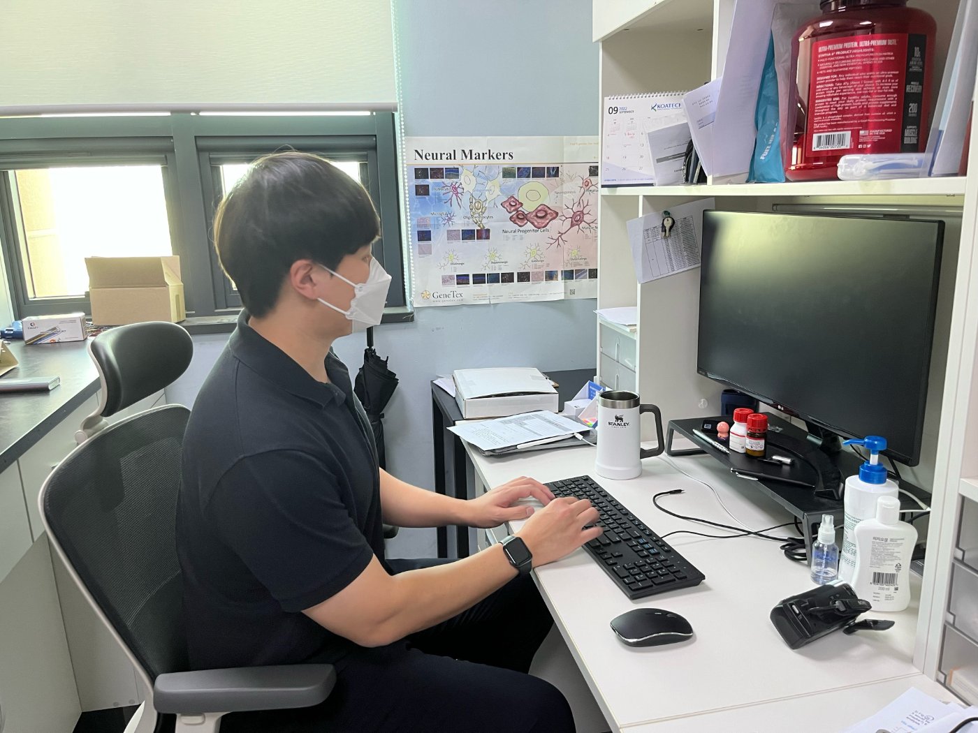 At the desk in the laboratory office